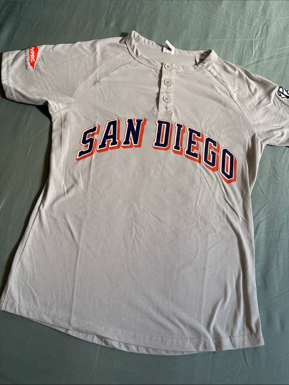 cotopaxi light gray Henley jersey with navy & orange SAN DIEGO script